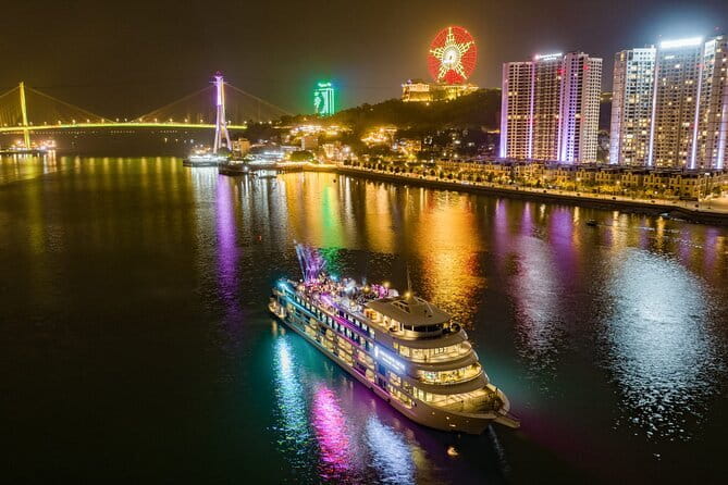 Ambassador Dinner Cruise with Live Music, Firework and Luxe - Halong Bay after dark, with the city in view