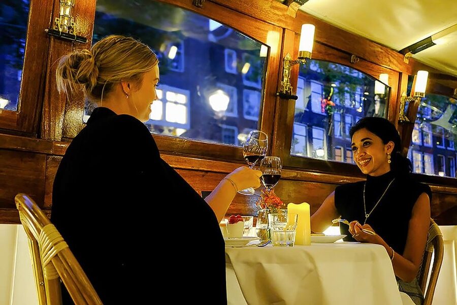 Amsterdam: Luxury Saloon Boat Cruise with 3-Course Dinner - A warm saloon boat for a cooler Amsterdam evening