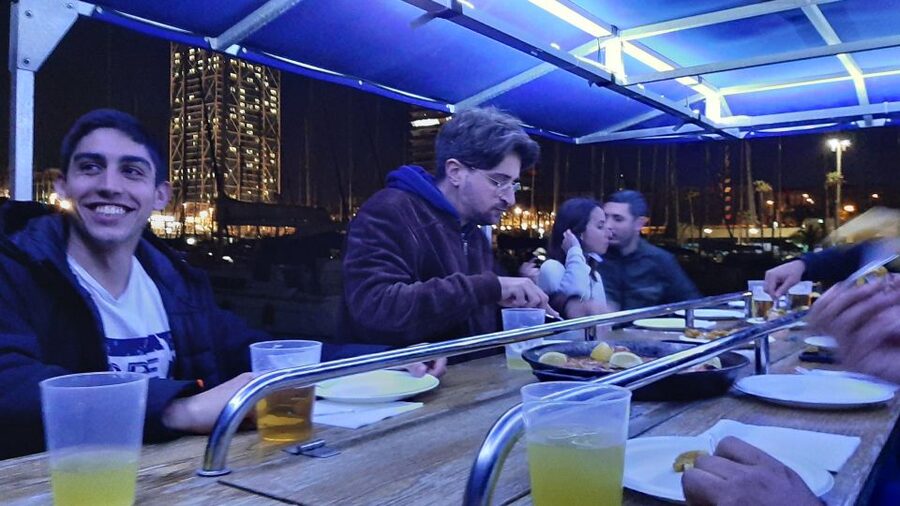 Barcelona: Private Evening Cruise with Dinner and Drinks - Coastline views after sunset