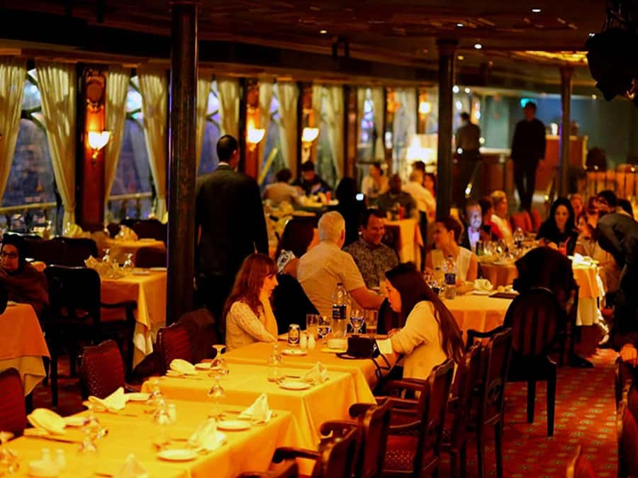 Cairo: Nile Dinner Cruise with Belly Dancer Show with Pickup - Boarding the boat and finding your evening view