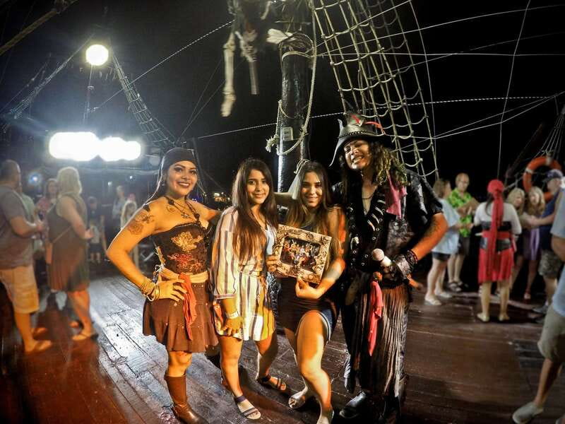 Cozumel: Pirate Ship Cruise with Open Bar, Dinner, and Show - Boarding the replica galleon at sunset