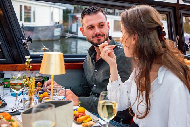 Dinner Canal Cruise Amsterdam: 4-Courses Including Drinks - Dinner with Amsterdam passing outside the window