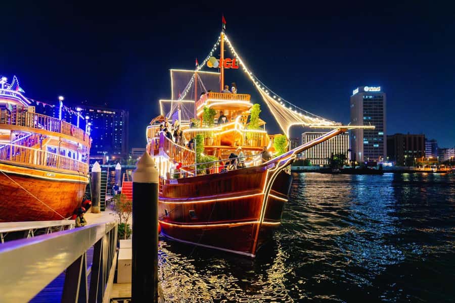 Dubai: Al Seef Largest Dhow Dinner Cruise with Live Show - Dinner on board: barbecue, vegetables, and sweets