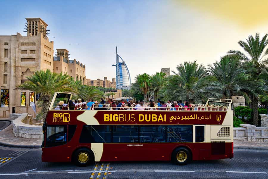 Dubai: Big Bus Panoramic Night Tour & Optional Dinner Cruise - Palm Jumeirah and the entrance to Atlantis