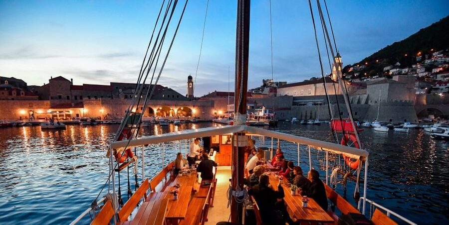 Dubrovnik: Sunset Dinner Cruise around the Old Town - Sunset, candles, and dinner on the Adriatic