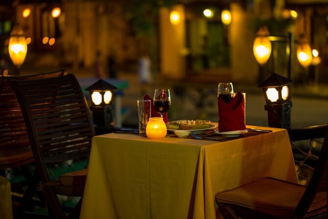 Experience Romantic Sunset Dinner Cruise in Hoi An - Watching Hoi An from the water