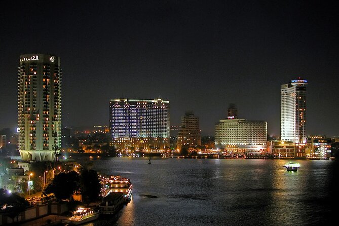 From Cairo: 5 Stars Nile Dinner Cruise with Live Entertainment - Cairo at night from the water
