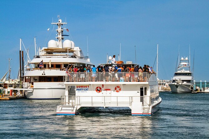 Key West Sunset Buffet Dinner Cruise with Open Bar and Live Music - Watching the Key West sunset from the top deck