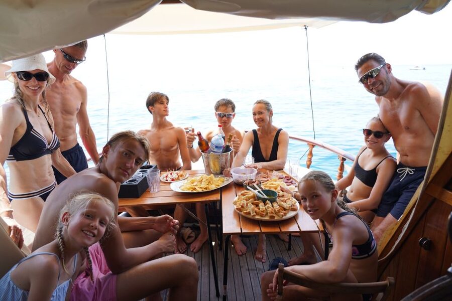La Spezia: Sunset Cruise with Aperitif and Dinner - Dinner with Portovenere lit up behind you