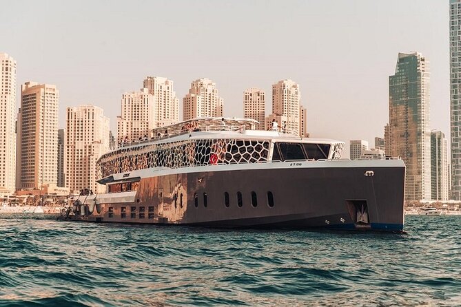 Lotus Mega Yacht Luxury Cruise with Live DJ, Dinner & Transfers - Burj Al Arab and the JBR skyline after dark