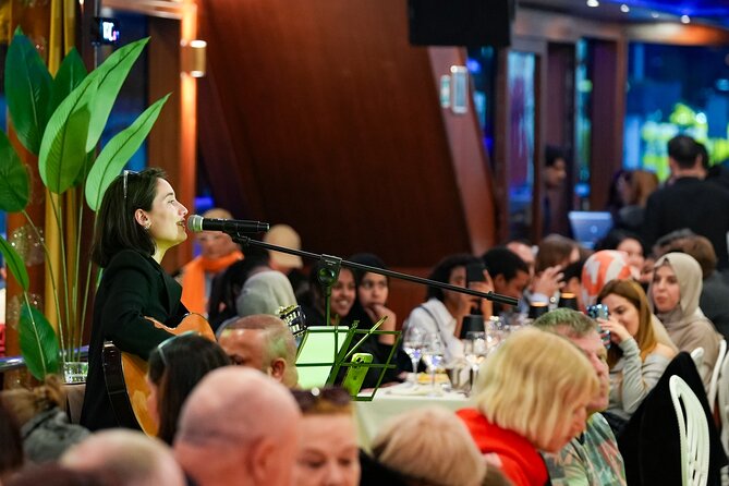 Luxury Bosphorus Dinner Cruise with Show & Hotel Pickup - Dinner, music, and seating aboard the yacht