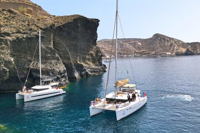 Luxury Santorini Sunset Cruise: Dinner, BBQ, Open Bar, Transfers - Transfers, timing, and what to bring