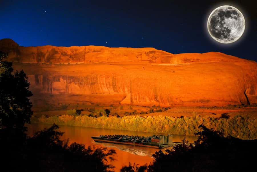 Moab: Colorado River Dinner Cruise with Music and Light Show - The flat-bottomed boat and the first stretch of river