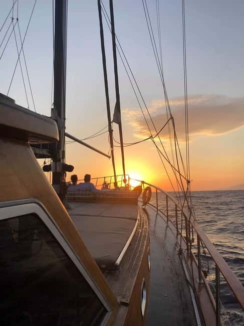 Mykonos: Sunset Boat Cruise with Light Dinner & Drinks - Dinner on board, with fish, vegetables, and local flavor