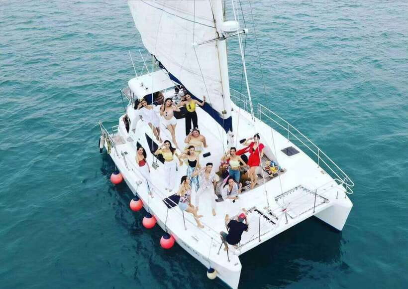 Phuket: Coral Island Catamaran Cruise with Sunset Dinner - Guides, crew, and group size
