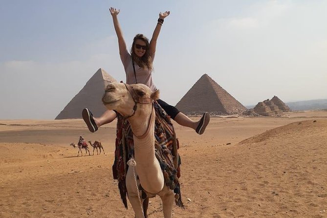 Private Full-Day Cairo Tour Including Giza, Solar Boat Museum, Felucca, and Nile Dinner Cruise - Giza’s pyramids, Sphinx, and a camel ride
