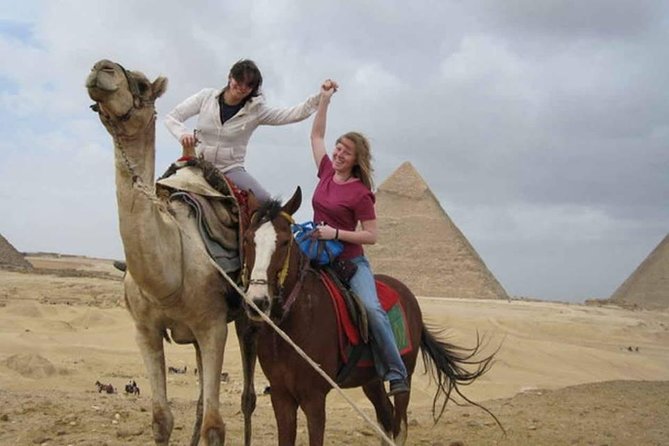 Private Guided Day Tour: Giza Pyramids, Egyptian Museum and Nile Dinner Cruise - Standing before the Giza Pyramids