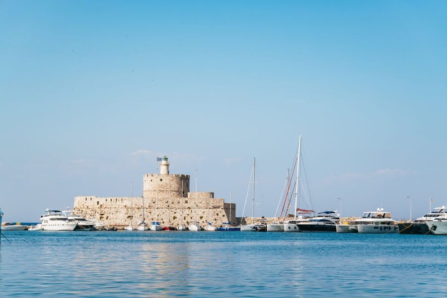 Rhodes: Sunset Catamaran Cruise with Dinner Buffet & Drinks - Sunset over Rhodes from the return route