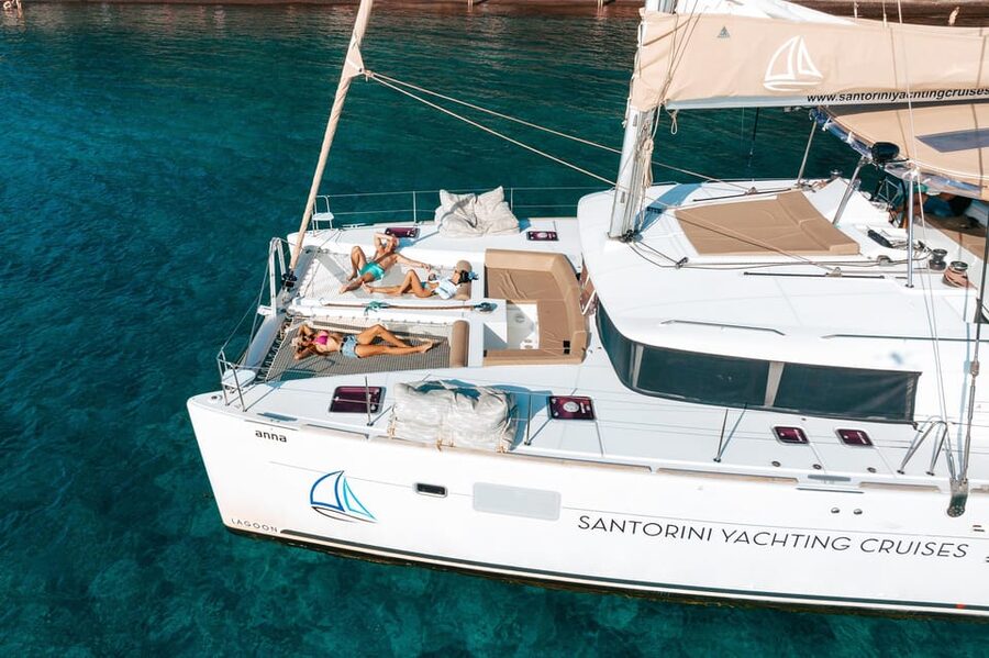 Santorini: Luxury Sunset Cruise with Dinner, BBQ, and Drinks - Entering the Caldera and reaching the hot springs