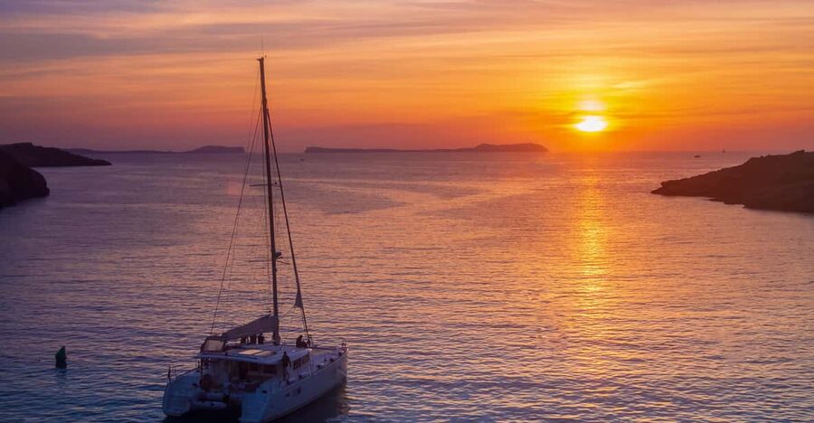 Santorini: Luxury Sunset Cruise with Dinner, BBQ, and Drinks - Leaving Vlychada and following the southern coast