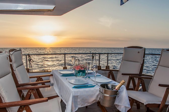 Santorini: Motor Yacht Sunset Cruise with 5-Course Dinner - Sunset from the water, not necessarily from Oia