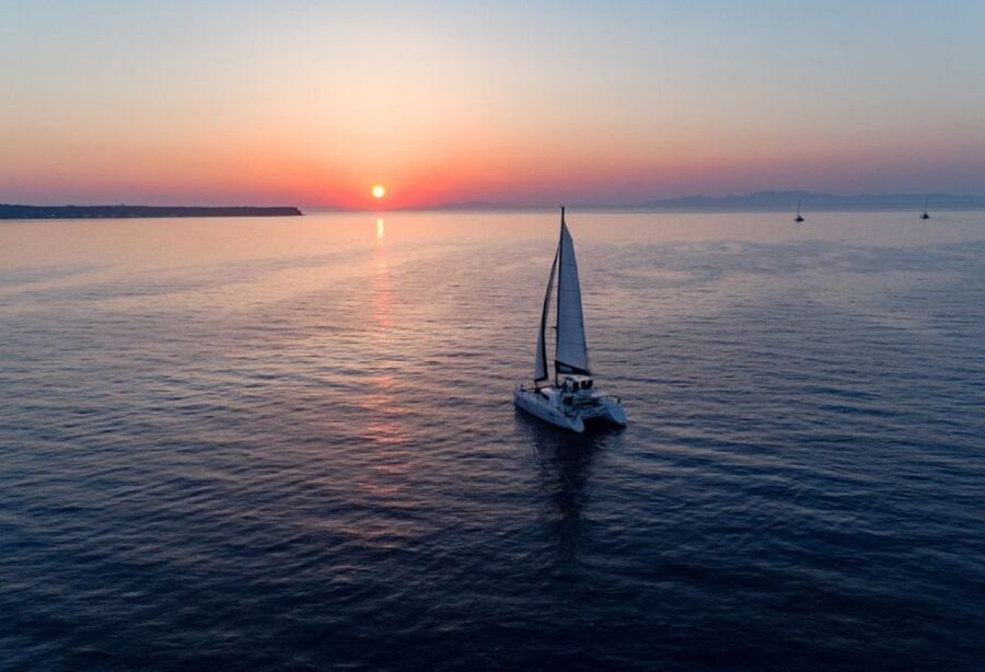 Santorini: Private Sunset Cruise with Dinner and Drinks - Snorkeling in the Aegean Blue