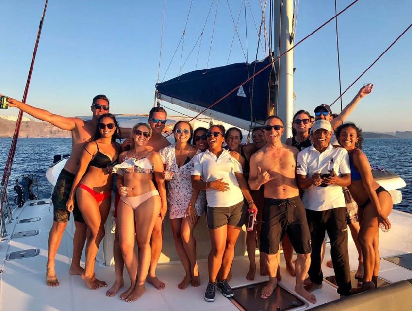 Santorini: Sunset Cruise with Greek Dinner and Transfer - Greek dinner served as the sun drops