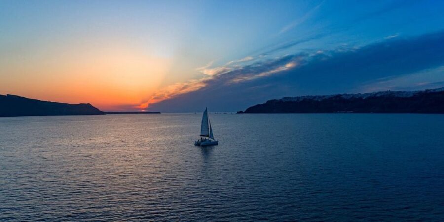 Santorini: Sunset Cruise with Swim Stops, Dinner, and Drinks - Red Beach and the first swim