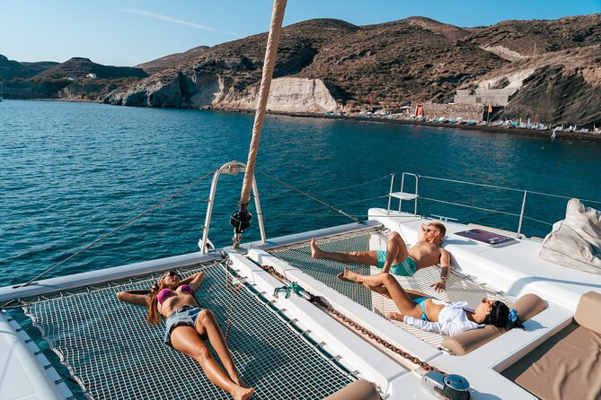 Santorini Sunset Sailing Cruise: Dinner, BBQ, Open Bar, Transfers - White Beach, Indian Rocks, and the Venetian Lighthouse