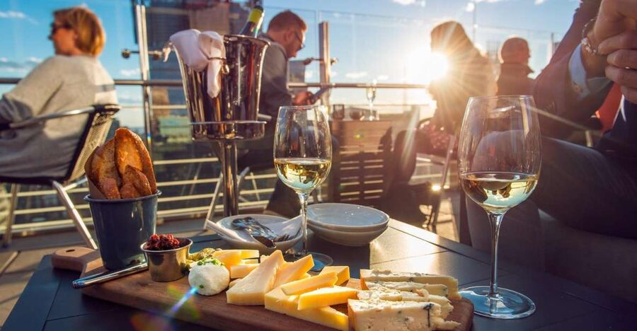 Santorini: Volcano and Hot Springs Sunset Dinner Cruise - From Athinios Port to the caldera