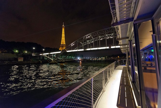Seine Dinner Cruise, Eiffel Tower Access and Moulin Rouge Show - Riding through Paris toward Montmartre