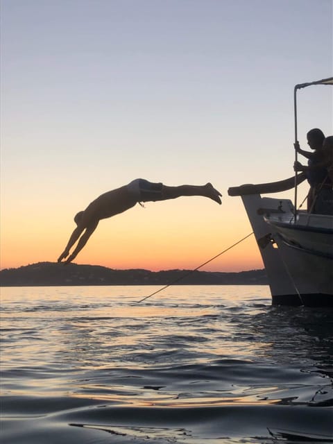 Skiathos: Boat Cruise with Dinner & Sunset Viewing - Sunset near Agia Eleni and Banana