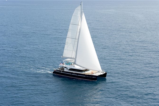 Summer Fireworks and Dinner Catamaran Cruise from Cannes - Sailing past the Lérins Islands before sunset fades