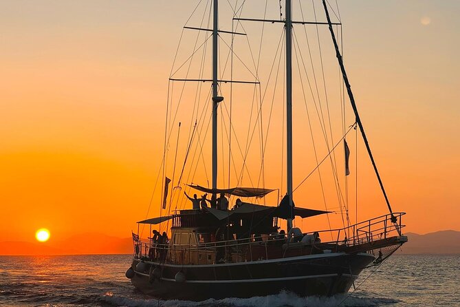 Sunset Dinner Cruise: Sunset, Swim, Drinks, and Dinner Onboard - Leaving Piraeus for an evening on the water