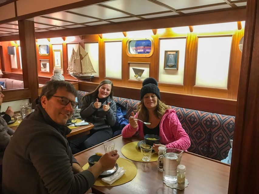 Tromso: Luxury Northern Lights Cruise with Hot Tub & Dinner - Reindeer stew, hot drinks, and practical comforts